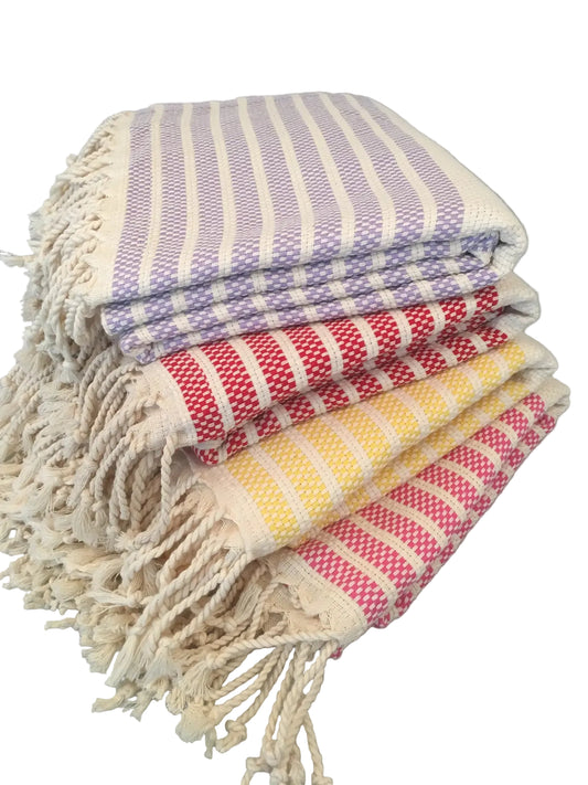 Hittite peshtemal – stack of towels in lavender, red, yellow and pink stripes